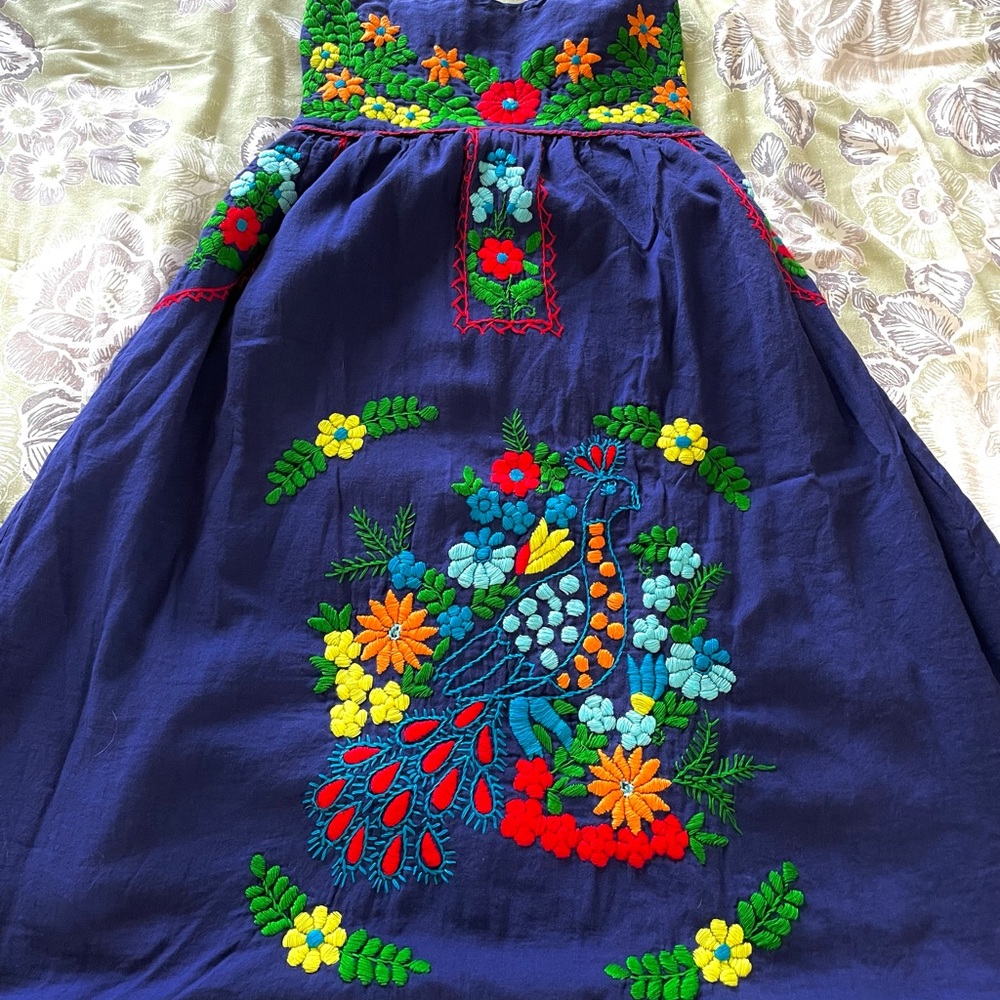 Large Beautiful, strapless and embroidered dress.